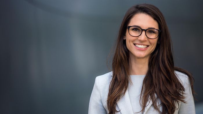 Young HR business partner looks into the camera