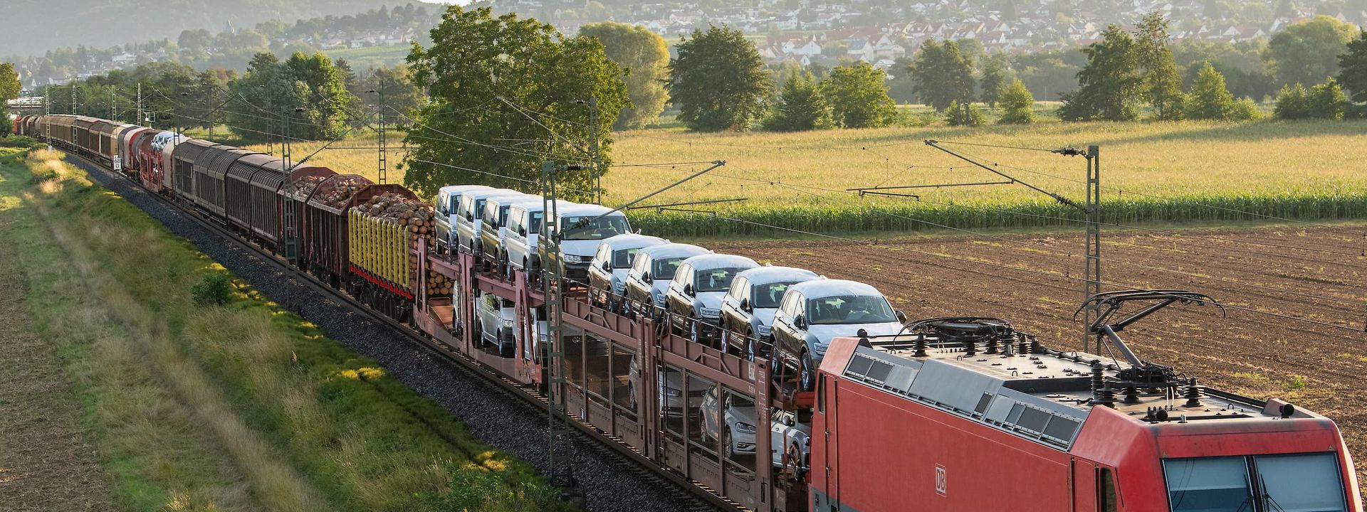 Freight train in motion carrying finished vehicles
